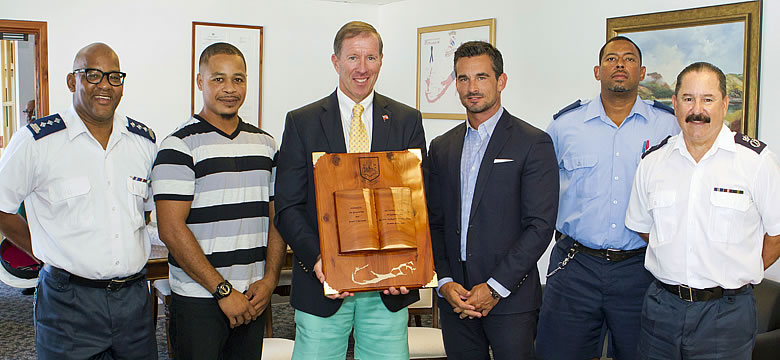 Premier Dunkley pictured with the cedar carving
